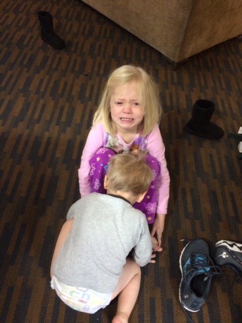 Finn Girl crying because I asked her to put her shoes away. Little Finn tried to comfort her.